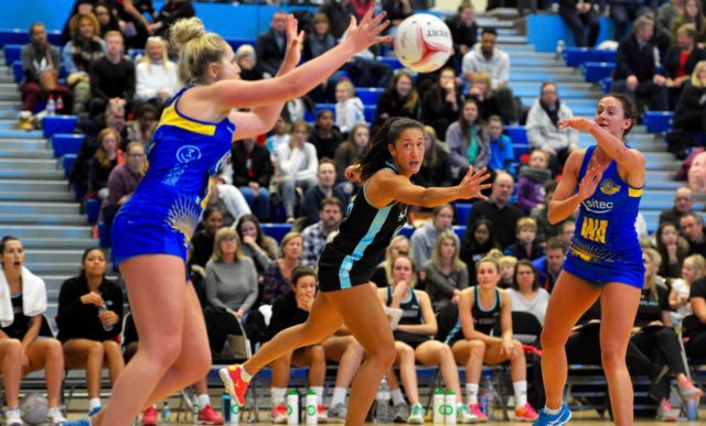 Rachel Shaw passes to Chelsea Lewis during Team Bath Netball's 35-34 win over Surrey Storm