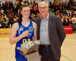 Player of the match Sophie Drakeford-Lewis receives her Wild About Flowers bouquet from University of Bath Director of Sport Stephen Baddeley