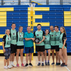 Interaction receive the charity netball tournament trophy