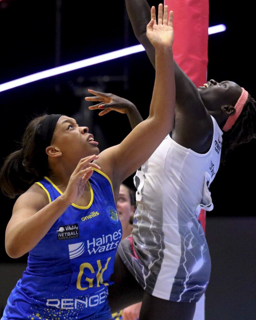 Netballers Eboni Usoro-Brown and Mary Cholhok challenge for an aerial ball.